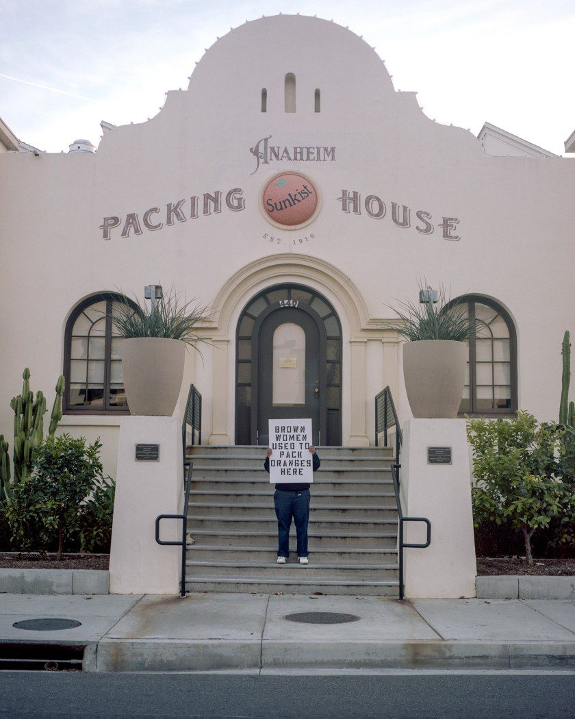 A person standing on the steps of a building